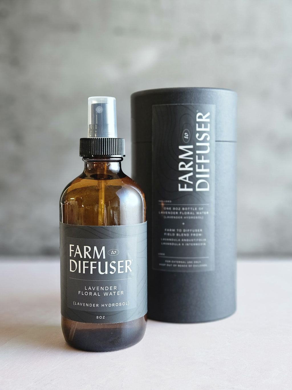 8oz Lavender Floral Water and the black paper tube with label that it is shipped in