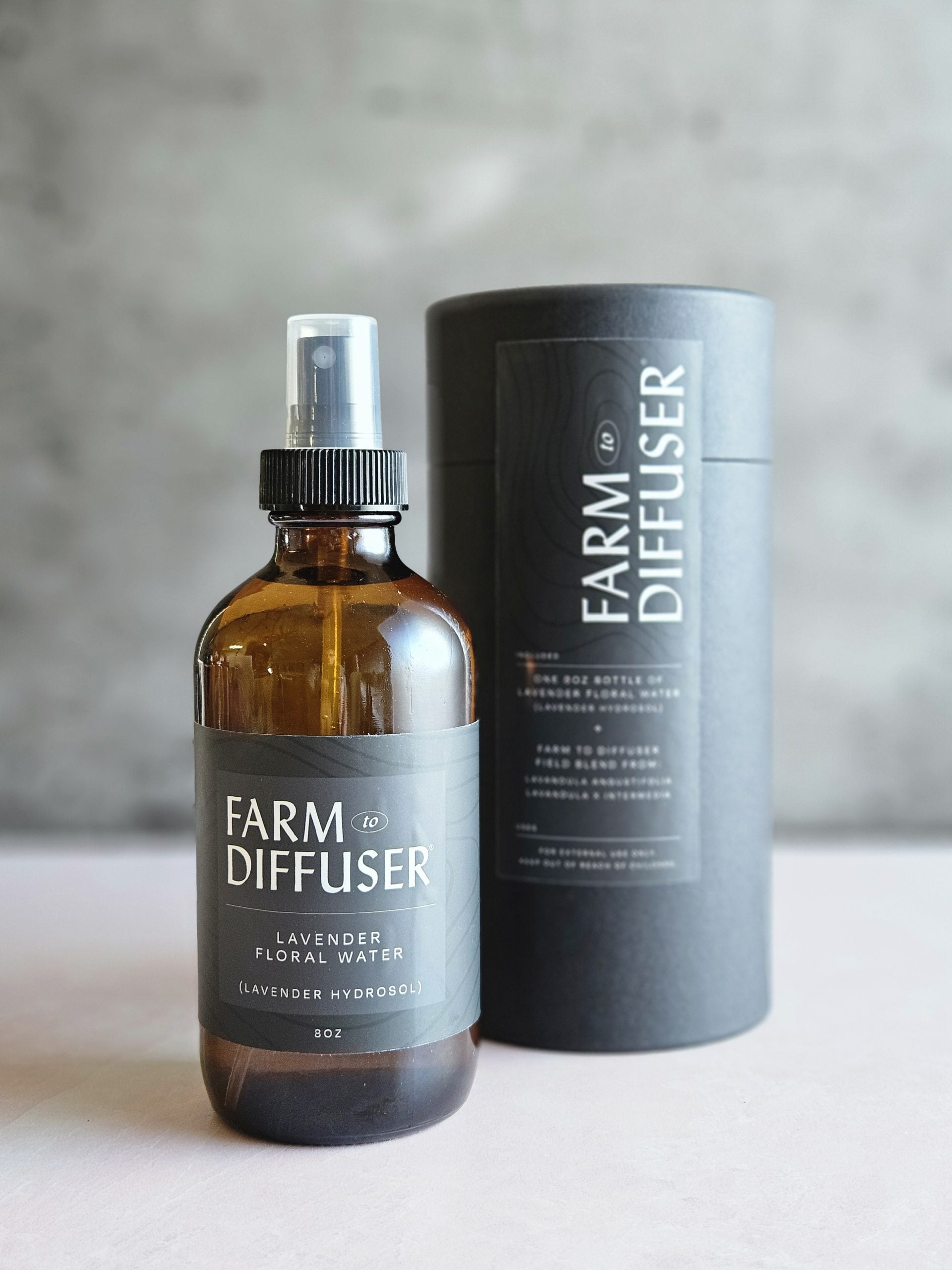 8oz Lavender Floral Water and the black paper tube with label that it is shipped in