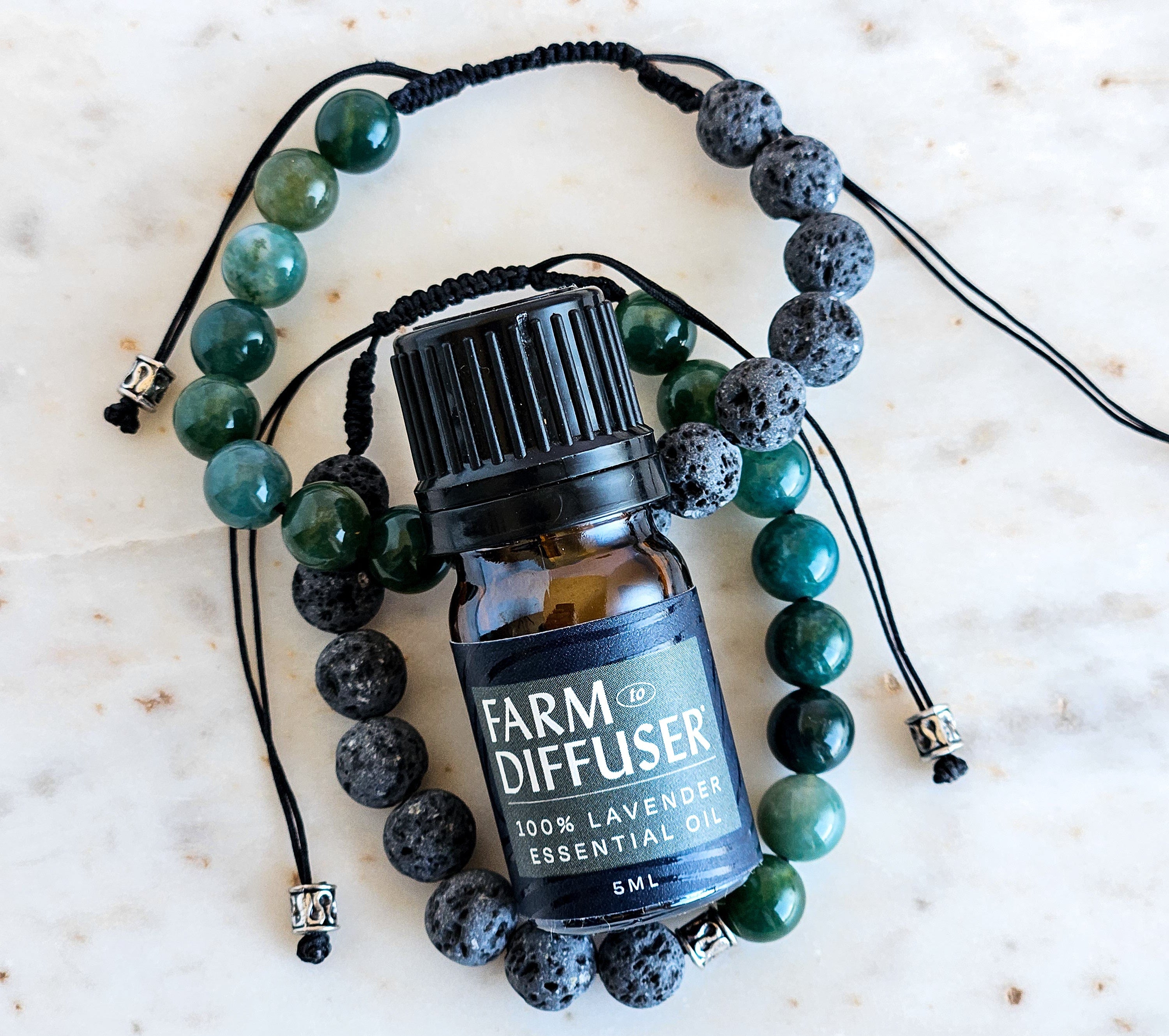 Laender Essential Oil bottle on a beaded bracelet with a white background