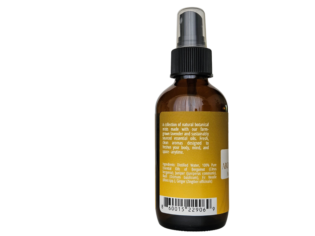 4 fl oz mist bottle showing ingredient label: juniper, bergamot, fir, ginger, basil | no synthetic fragrance