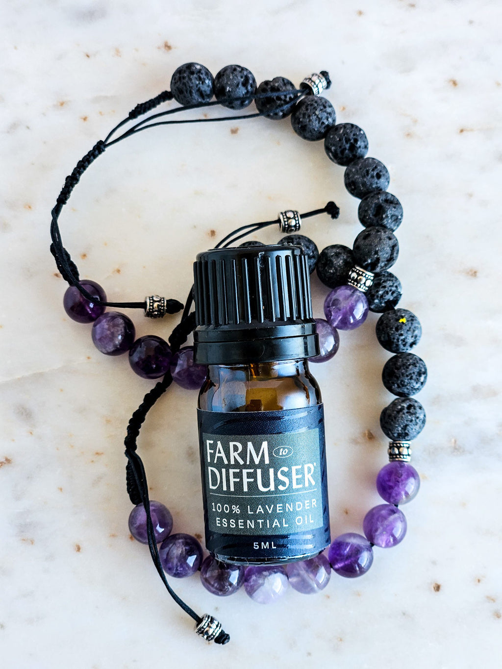 Lava Stone Diffuser bracelet amethyst gemstones lavender essential oil on marble